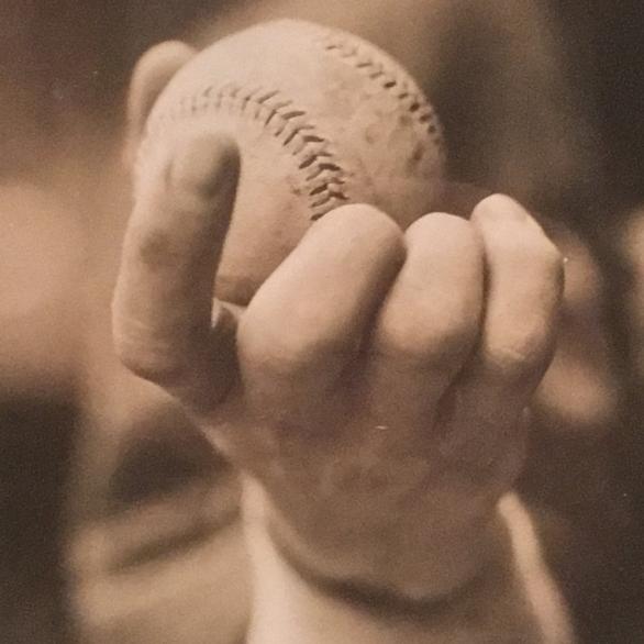 The Knuckleball, a 1913 photo of a baseball held by pitcher Eddie Cicotte